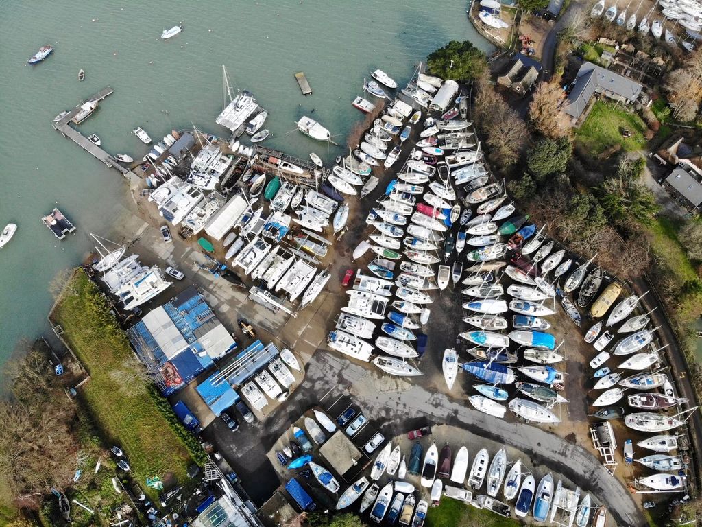 Top-down view of the boats arranged across Wilson's Boatyard beside the creek.