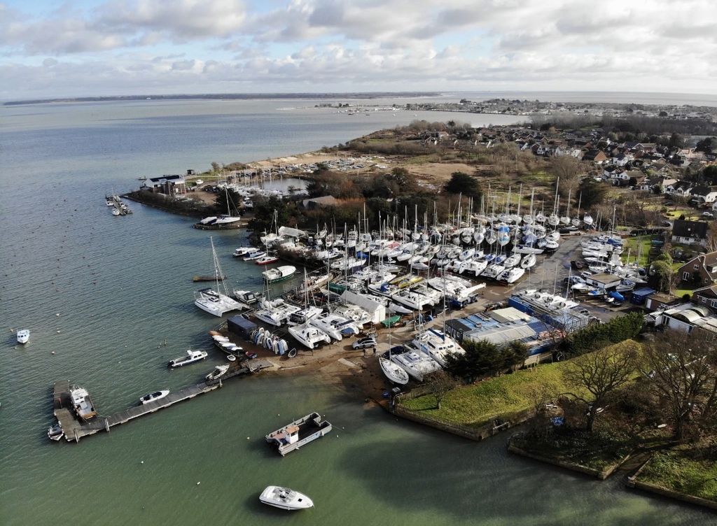 Aerial view of Wilson's Boatyard beside the sheltered creek on Hayling Island.